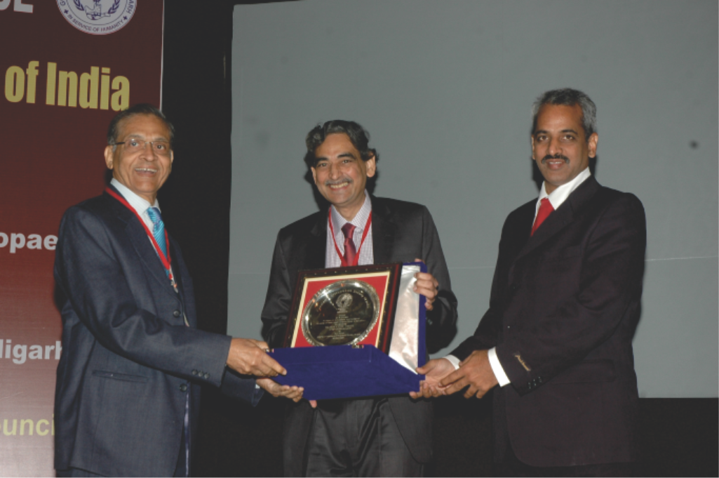 Receiving award for his 17 years of service to POSI - At POSICON 2011 in Chandigarh